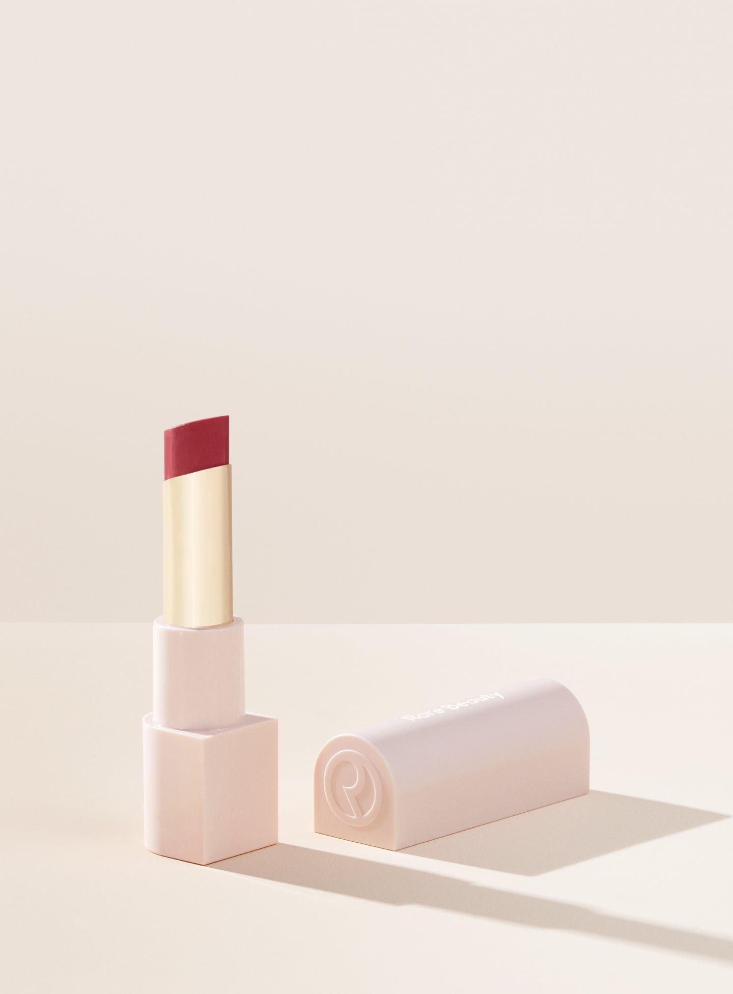 RARE BEAUTY with gratitude dewy lip balm SUPPORT ...A hydrating lip balm with a kiss of dewy, buildable color that looks and feels so good your lips will thank you.